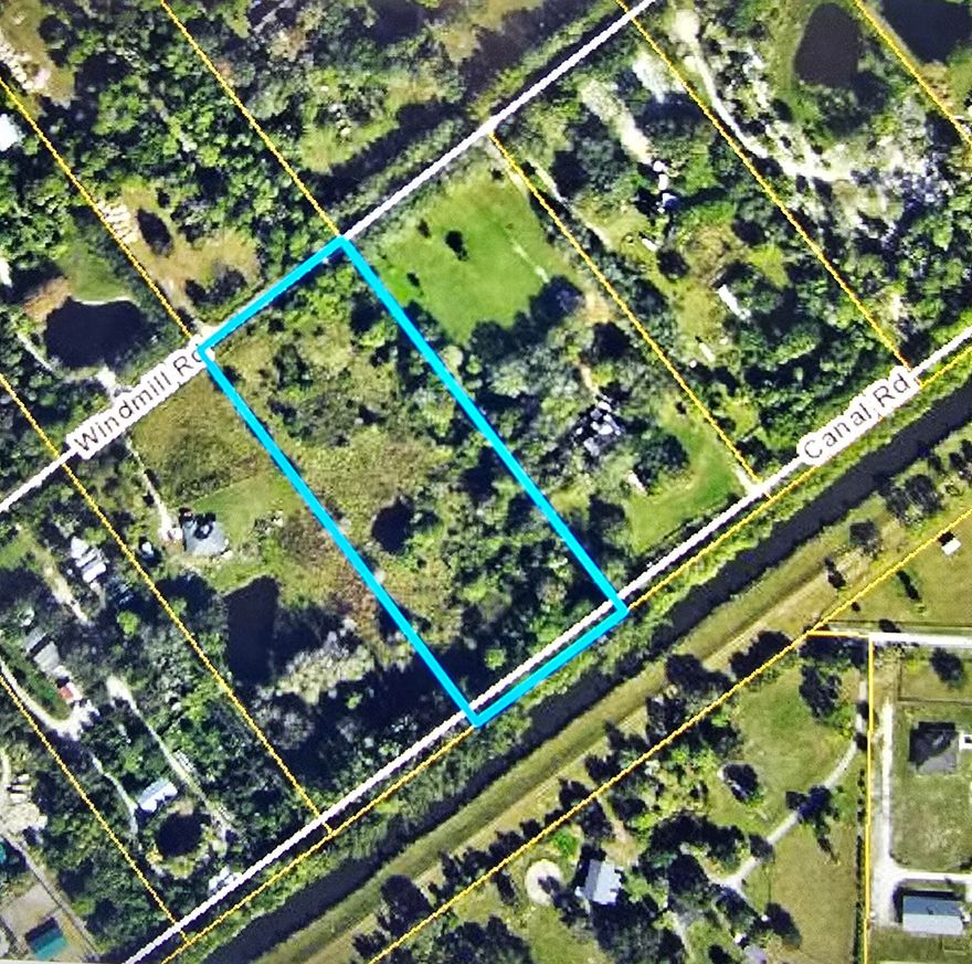 Lowest price in the Acreage of Loxahatchee. If you like privacy this is for you. Wide canal frontage great fishing spot. Build your dream home. Have a camping weekend get away. Equestrian welcome. Quite enough to ride the roads safely.
