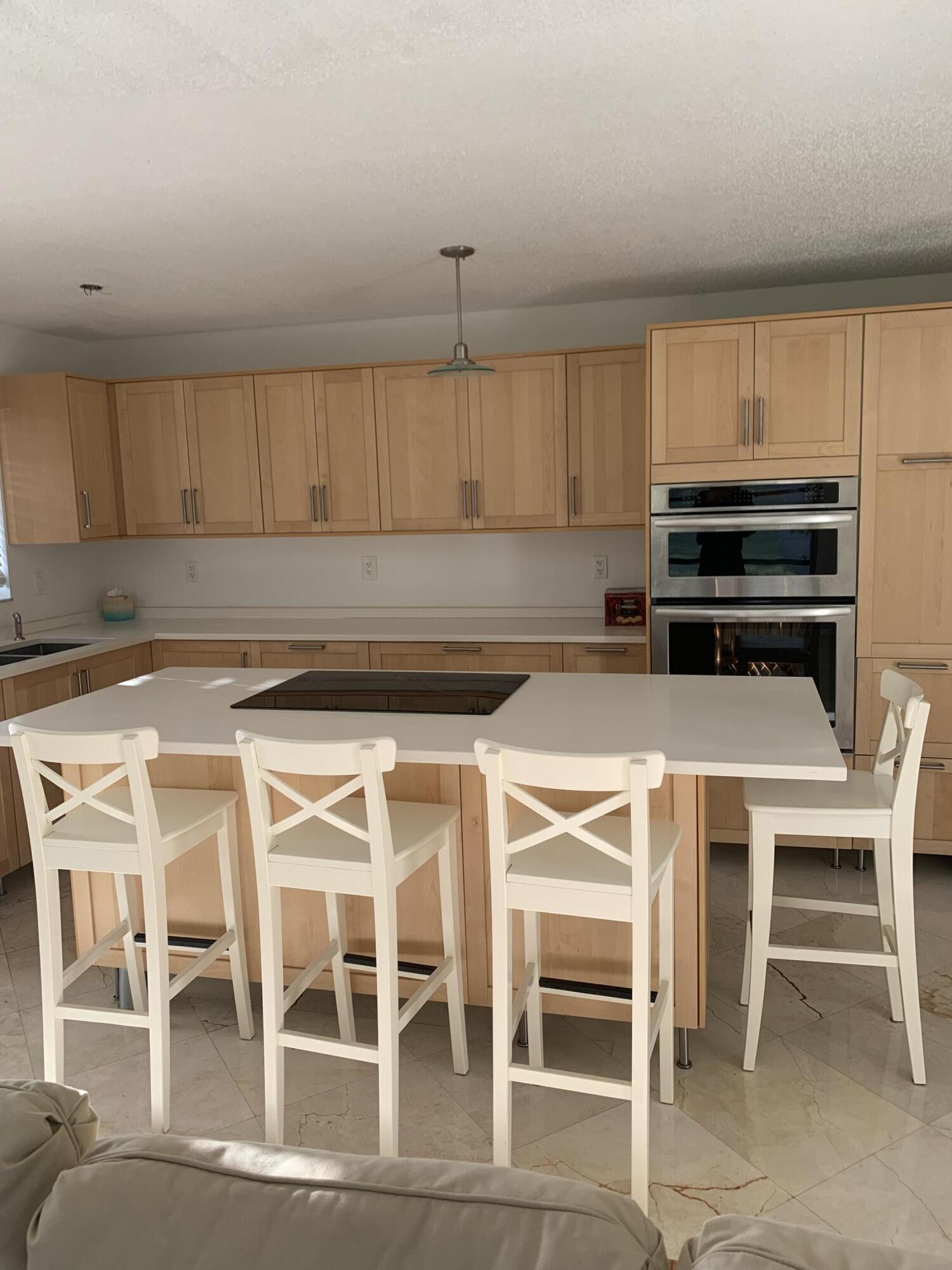 Updated corner unit offering you plenty of natural light. Marble flooring throughout the main living area with laminate flooring in the primary bedroom - 2nd bedroom features wood grain look ceramic tile with no carpeting to be found throughout this Delray Beach villa. Kitchen has been update completely with stainless steel appliances and quartz counters. If you are ready to escape the cold winters of the north and be just minutes to the beach and the restaurants of Atlantic Ave come see this home today.