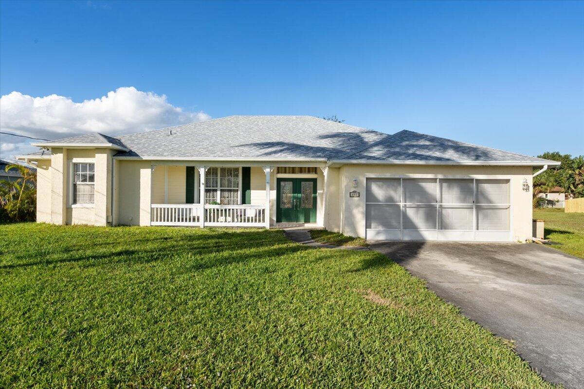 Affordable CBS Pool Home with NEW ROOF. Spacious 3 bed/2.5 bath NO HOA- Bring your boats & RV. Fenced yard, Shed & Generator located in a quiet neighborhood with easy access to I-95, Turnpike & Tradition. Cozy front porch living. The double doors open to the formal living and dining rooms. Kitchen overlooks the tranquil pool with lots of natural light. Spacious family room with vaulted ceiling leads out to the private pool with cabana bathroom. Oversized bedrooms for added comfort. Make this home yours today!