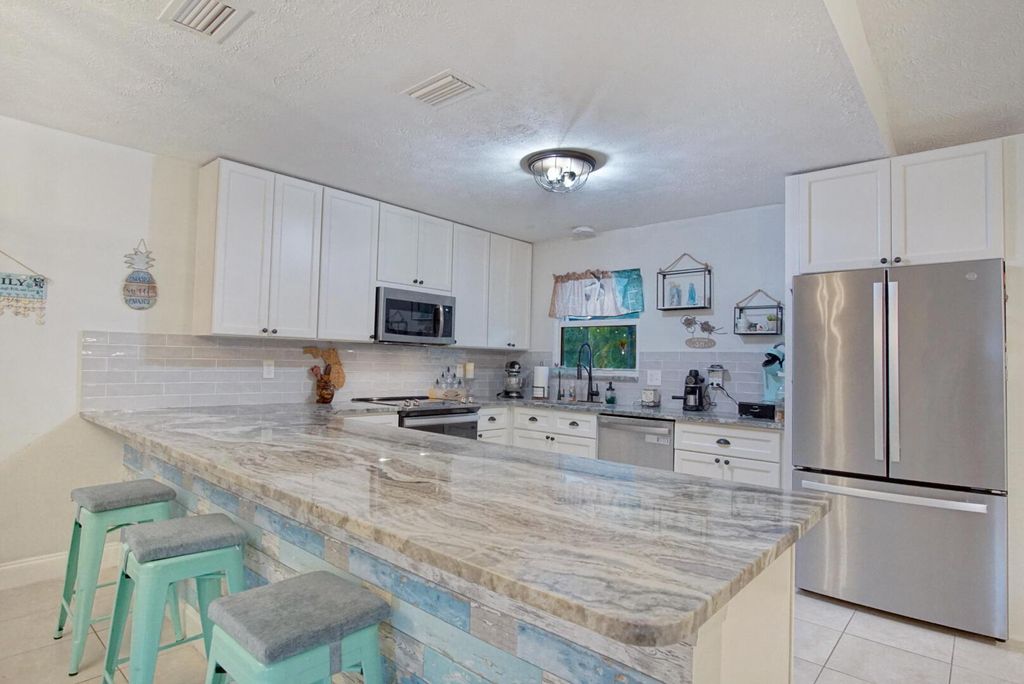 Photo of 1918 SE Cheltenham Street, Port Saint Lucie, FL 34983 (MLS # R10956184)