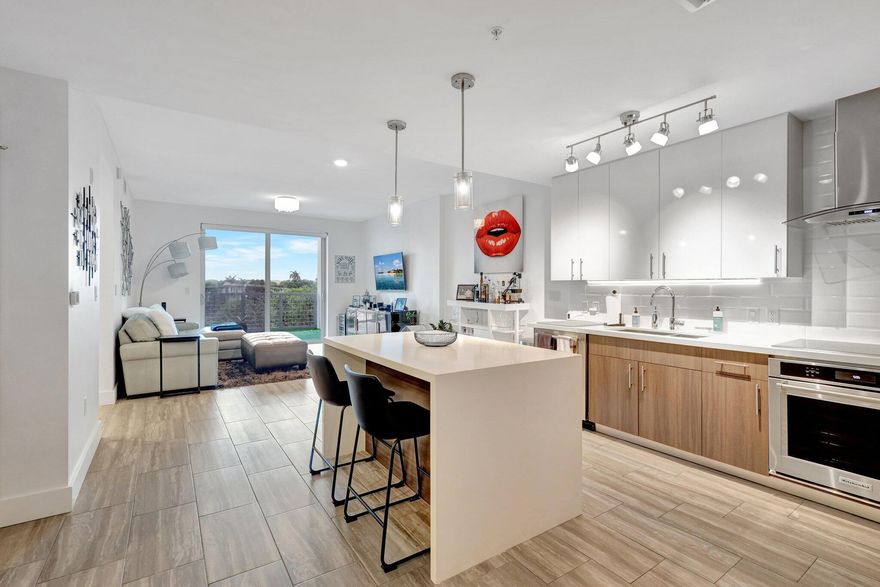 Welcome to this stunning, rarely available seasonal rental in one of Delray's newest luxury condo buildings, 236 Fifth. This 1 bedroom, 1 bathroom condominium has a spacious den that is being utilized as a dining room. Enjoy an open floorplan featuring a waterfall kitchen island, KitchenAid appliances, and stunning modern finishes. 236 Fifth Avenue is a full amenity building that allows residents to fully utilize the Aloft Hotel facilities including a stunning pool, gym, splash bar, full restaurant, owner's terrace, and club room. Located just a mile from the beach and two blocks from famed Atlantic Avenue, you won't want to miss the opportunity to call this newer condo home, in the heart of downtown Delray Beach.