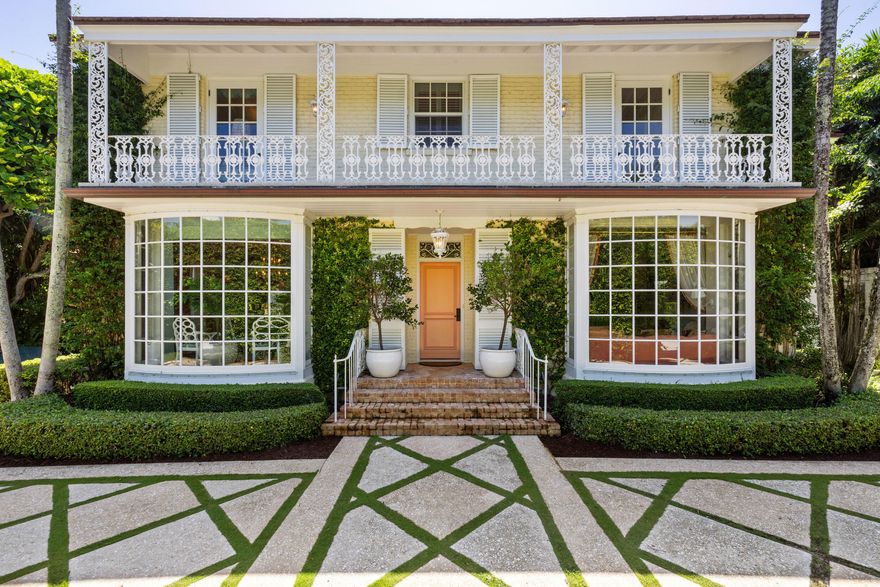 Just four houses from The Colony Hotel, this elegant in-town residence captures the essence of Palm Beach living. Set on an oversized 13,068-sq-ft lot, the 6,205-sq-ft property offers a main house, garage apartment, and poolside cabana surrounded by lush landscaping. The interior features 5,272-sq-ft under air with three upstairs en-suite bedrooms, a first-floor en-suite, and a private guest suite above the two-car garage. A covered loggia opens to the pool for effortless indoor-outdoor entertaining. Combining classic architecture, modern comfort, and an unrivaled location near the beach, Worth Avenue, and fine dining. This home defines sophisticated Palm Beach living and exudes ISLAND CHARM!
