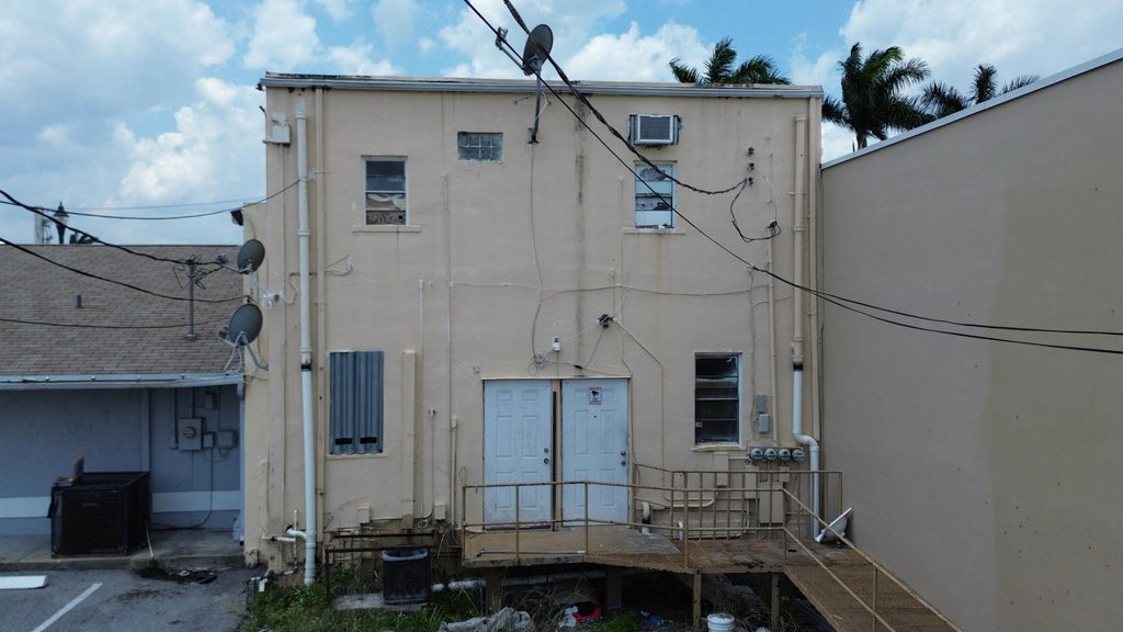 Photo of 363 S Main Street, Belle Glade, FL (MLS # B26044410)