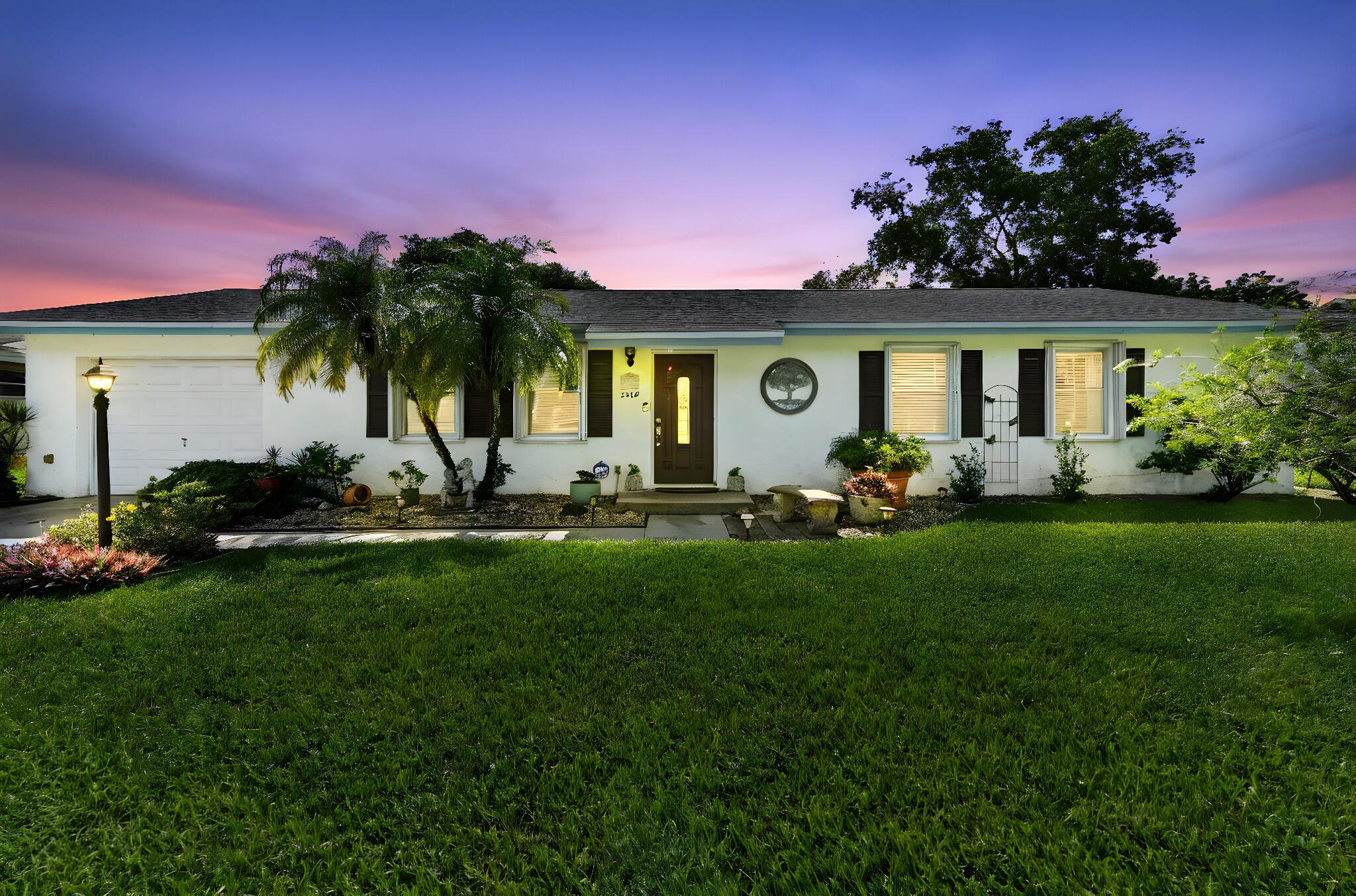 Discover tranquility and comfort in this charming waterfront single-family home, perfectly situated in the desirable community of Lakes of Sherbrooke in Lake Worth, FL. This inviting residence features 3 bedrooms, 2 bathrooms, and a convenient 1-car attached garage. Step inside to a warm and cozy living room, setting the tone for a relaxed lifestyle. The heart of the home lies in its combined kitchen and dining area, boasting elegant quartz countertops and ample cabinetry, creating a functional and stylish space for both everyday meals and entertaining.