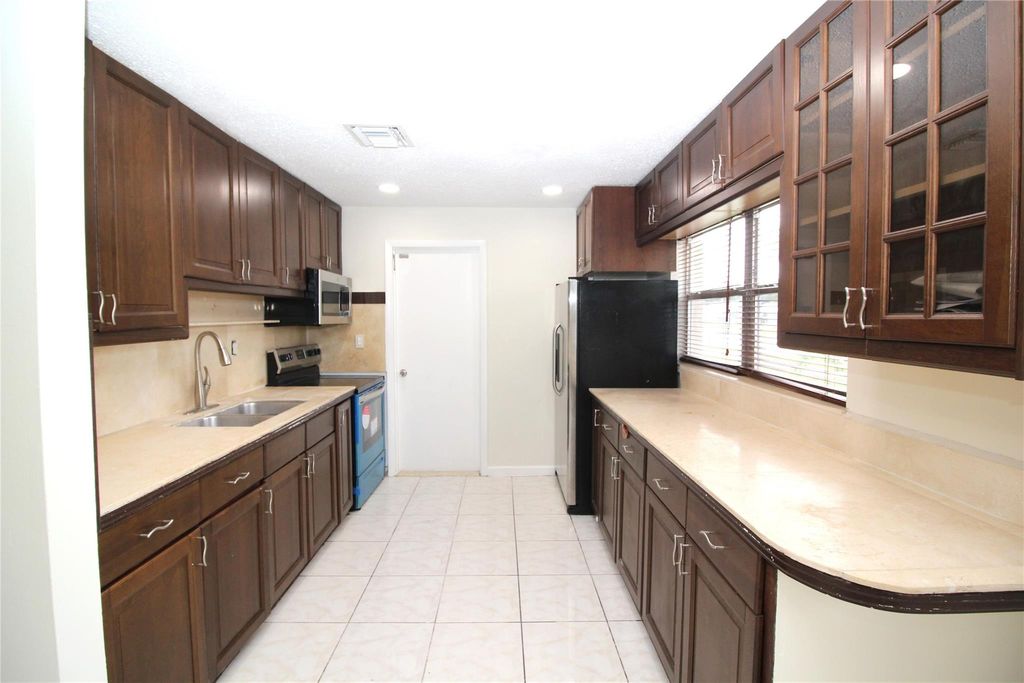 Photo of 3910 SW 61st Ave, Davie, FL 33314 (MLS # F10529802)