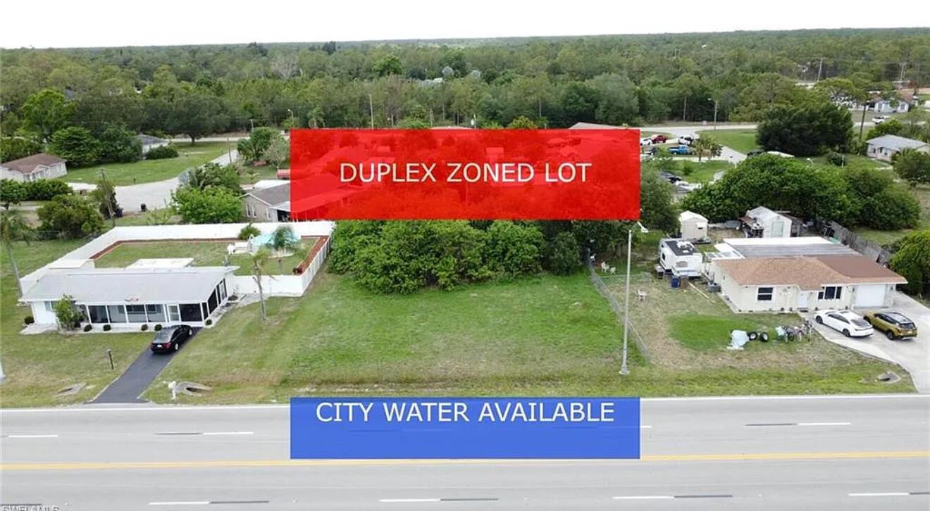**DUPLEX ZONED LOT -- WITH CITY WATER!** Environmental report available showing this is an upland (no wetlands) with no turtles! Access to city water - very rare in Lehigh! This desirable duplex lot in a well established part of Lehigh Acres, right on Joel Blvd! Zoned for a duplex or single family home. Lot is already mostly cleared off with just some small trees/brush on the back side. Joel Blvd is a main road in Lehigh, so access throughout the city is easy and makes the location even more desirable. **Seller has other duplexes and single family home lots available in Lehigh** Not far to grocery stores, schools and other amenities. - Major airport just a quick drive away as well as other adventures to explore!