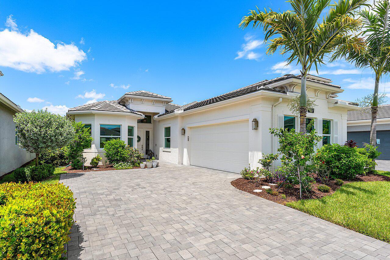 Situated on one of the most coveted private lots in the highly desirable Polo Trace community, this model-like home offers a bright, open floor plan and a thoughtfully designed layout filled with upscale upgrades. The interior showcases a neutral, timeless palette that appeals to all styles, along with elegant cabinetry, premium countertops, and artistic designer lighting that doubles as decor. The kitchen features under-cabinet lighting, ample storage, and upgraded finishes. The spacious laundry room includes a utility sink and custom cabinetry, while the coat closet offers the potential to be converted into a stylish bar. This home boasts three well-proportioned bedrooms, including a generous primary suite with a tray ceiling, dual walk-in closets, and a beautifully appointed bathroom