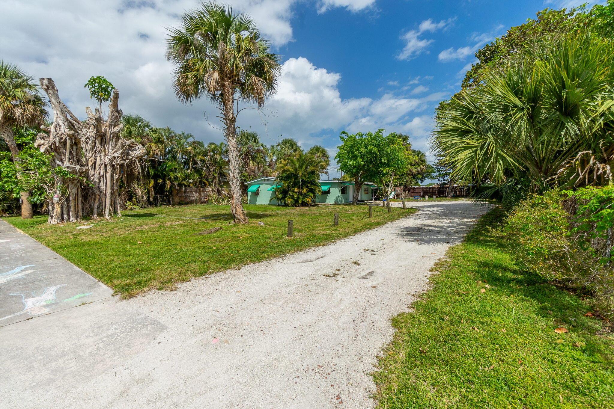 Tropical style 2/1 available for rent now. Very light, bright and efficient 2/1 available in Port Salerno. Tile & laminate floors throughout. This lovely rental home is a CBS half duplex with a new metal roof as of Dec 2023. It has it's own washer/dryer hookup in adjacent bldg for this unit. Central HVAC. Good sized rooms with an eat-in kitchen in this cozy rental home. This duplex is on a large lot with ample parking. It is ready for you to rent immediately. Landscape maintenance is included in the rent. City water. First $50 of water is included in the rent. Local reasonable experienced owner is the Landlord. Pets considered on a case by case basis. No outside storage. No boats. Come see it today!
