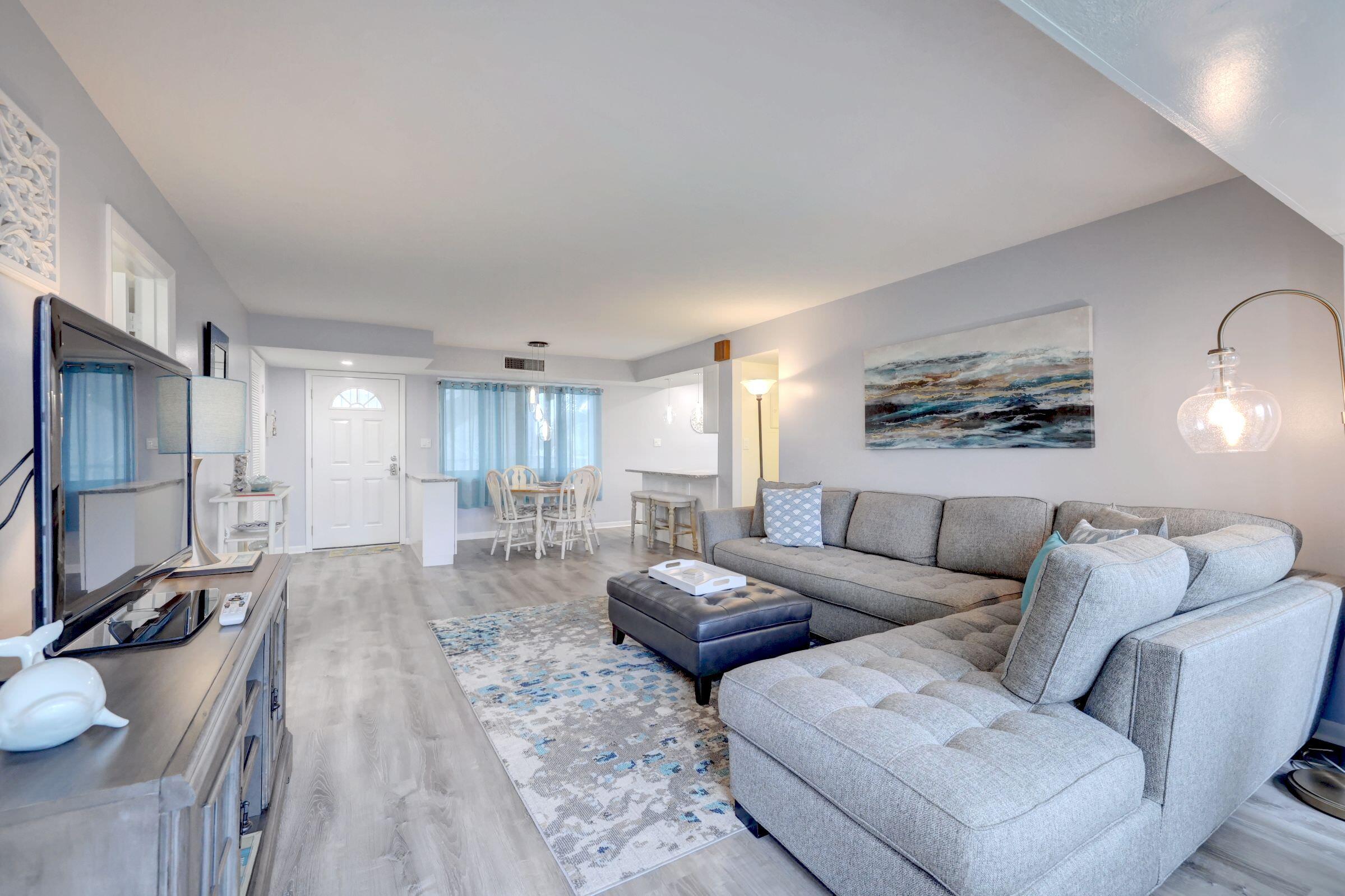Beautifully updated 2 bedroom 2 bath condo with modern beach chic decor located in desirable Ocean Village. Complete with luxury vinyl flooring throughout, entire unit just freshly painted, custom white wood shaker kitchen cabinetry, stainless steel appliances, exotic granite counter tops, glass tile backsplash & designer light fixtures. Newly remodeled master bath with custom tile shower A short stroll to 3000 ft of unspoiled beaches along the spectacular blue Atlantic Ocean. This private gated community offers all the amenities one can ask for: 4 heated swimming pools, tennis, golf, pickleball, shuffle board, bocce ball, fitness center, a lively tiki bar and onsite ocean front restaurant. Don't miss out on the opportunity to make living the Florida dream a reality - come see it