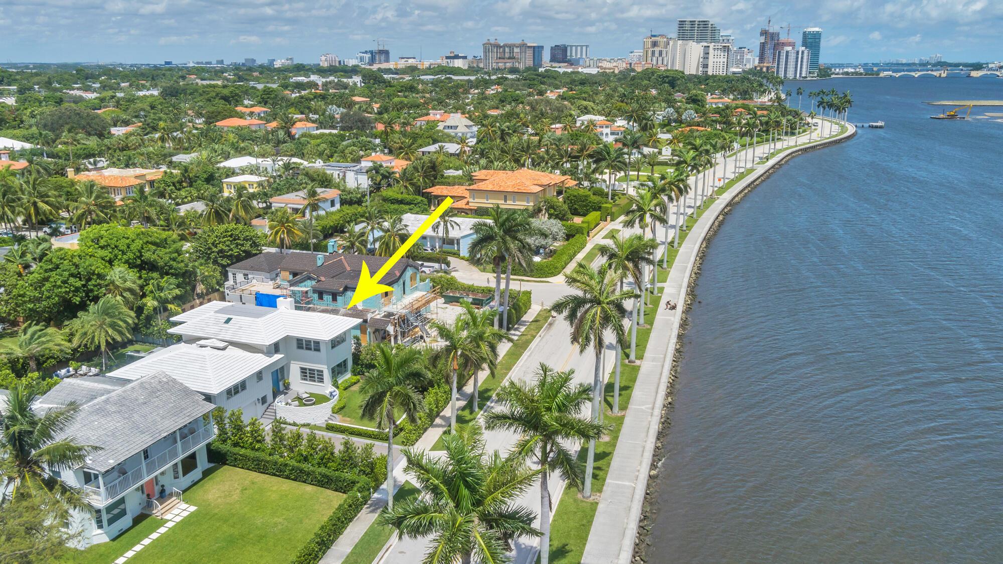 Just Completed on South Flagler Drive in the very sought-after Historic West Palm Beach. This mid-century home was completely renovated and expanded by Ritzzo Development and designed by Mizner award-winning FGS Design. While historic, the cedar paneled home is brand new featuring 3,908 square feet, 4 bedrooms, and 5.1 baths. While retaining its '60s glamour, the house features all of today's modern conveniences and design preferences by HW interiors, including real terrazzo tile and engineered hardwood floors throughout, an open kitchen with Thermador appliances, full Crestron home system lighting and music, and smart home technology. Corner windows in the living room and primary bedroom suite with marble master bathroom showcase waterfront views. Enjoy the resort-style outdoor space
