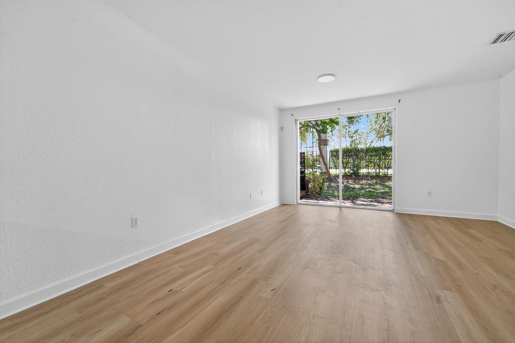 Photo of 4182 Napoli Lake Drive, Riviera Beach, FL 33410 (MLS # R11117386)