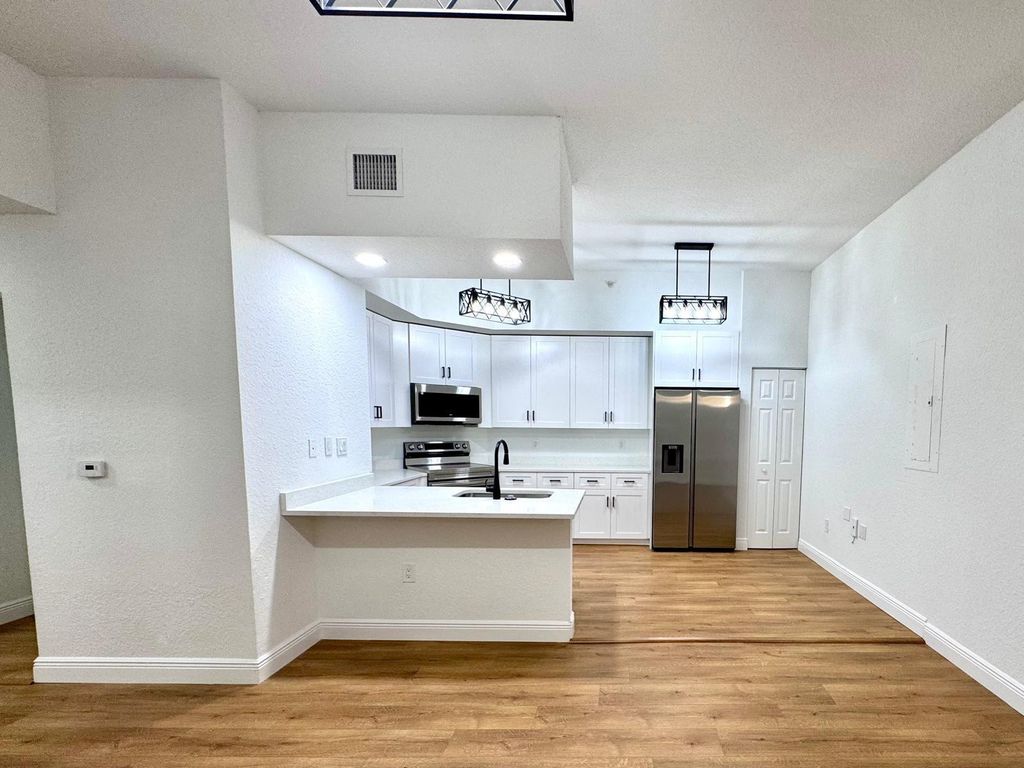 Photo of 2801 Riverside Drive #103 S, Coral Springs, FL 33065 (MLS # F10492006)