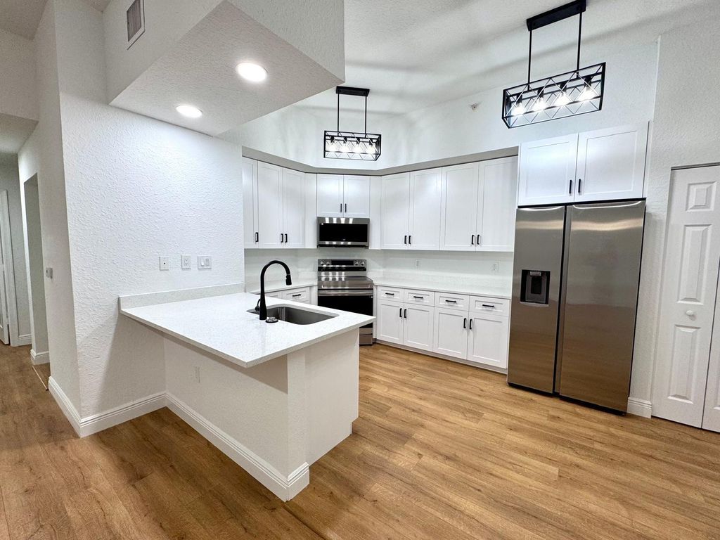 Photo of 2801 Riverside Drive #103 S, Coral Springs, FL 33065 (MLS # F10492006)