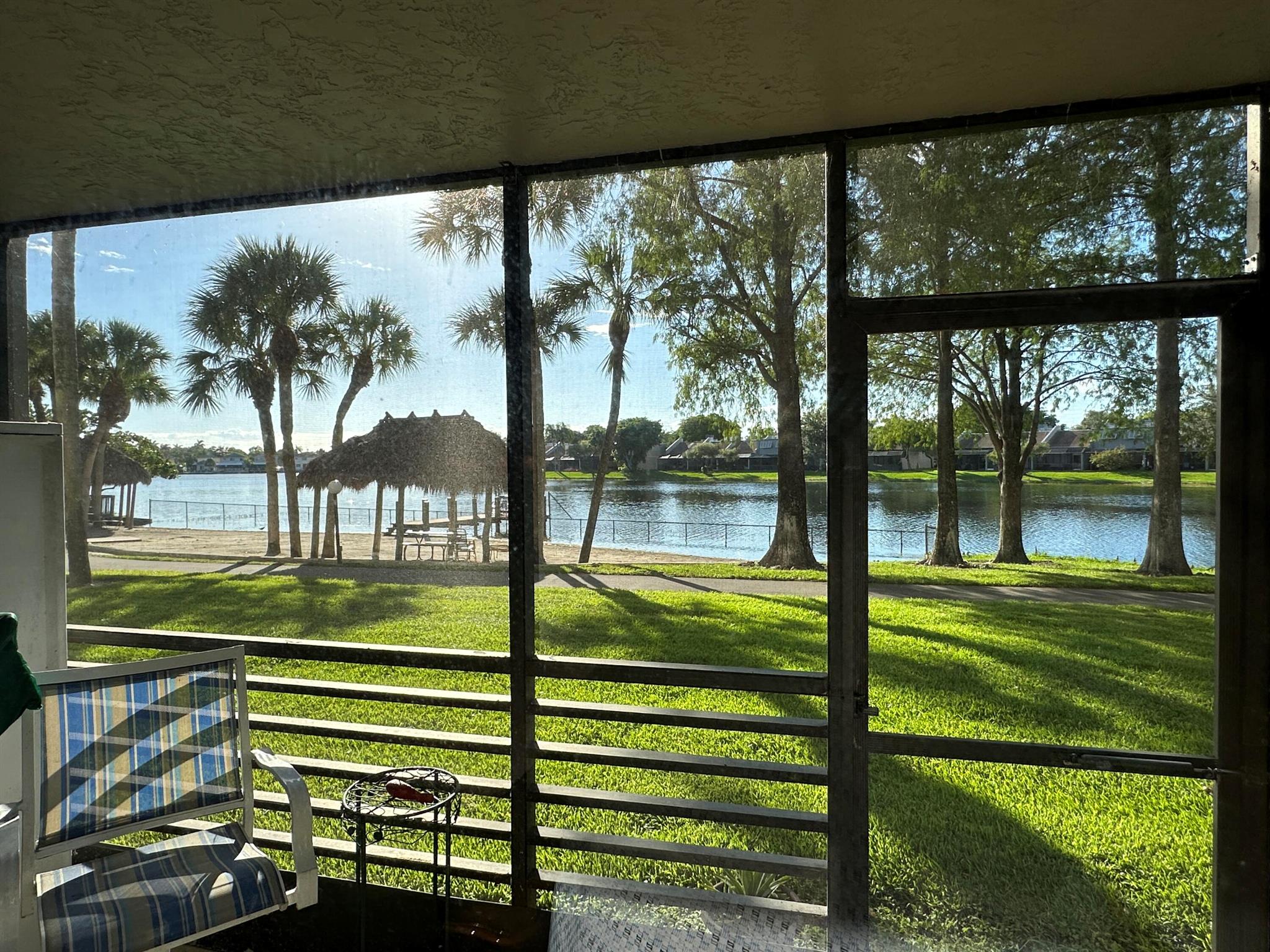 Location, Location, Location. Desirable Colony Point in 5 minutes from grocery stores, shopping, and Memorial West Campus. This 55+ Condo has beautiful lake views and within a short walk of the mail center and club house. An active retirement community with a full schedule activities. Upgrades throughout including rectified edge tile in foyer, kitchen, primary and wood flooring in dining room, living room and den is enclosed which could be used as bedroom. Updated kitchen, baths and floorings. HVAC replace in 2021.