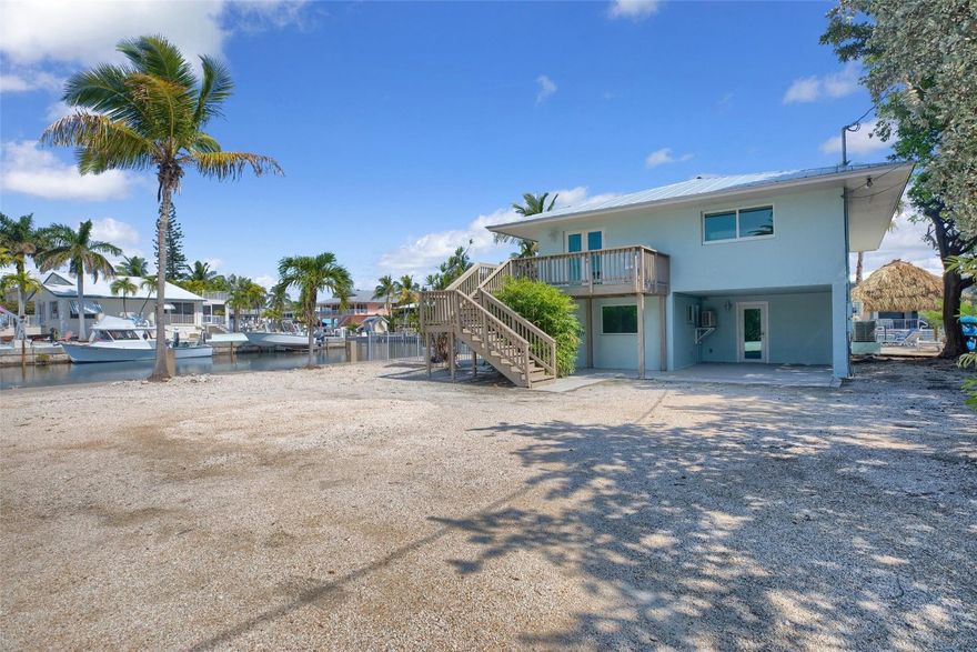 Unapproved Short Sale for Non-Conforming 2 Bed/3 Bath Waterfront Home in Marathon. Large corner lot with 205 feet of water frontage. First floor has non-conforming addition of 2 bedrooms and living area. Second floor nicely updated with renovated kitchen, baths and impact windows throughout.