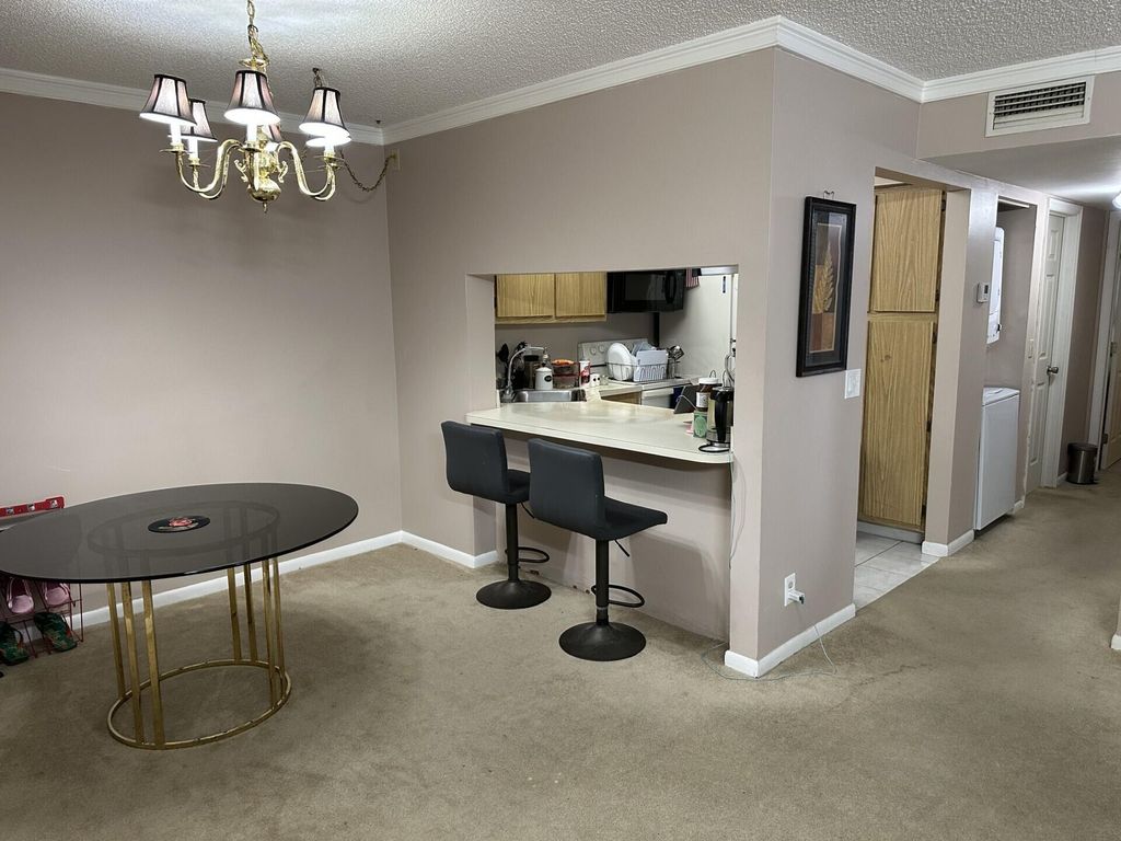 Photo of 1115 Green Pine Boulevard, West Palm Beach, FL 33409 (MLS # B26001481)