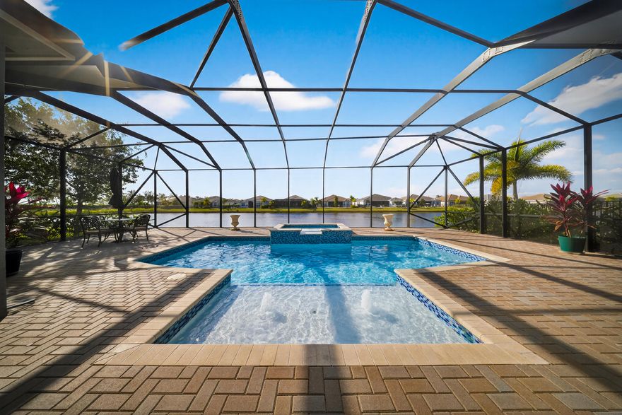 Discover this beautiful lake front pool home located in the sought-after Riverland Tradition area. This spacious residence features an open, bright layout with high ceilings, a modern kitchen with ample cabinetry, and generous living and dining spaces perfect for entertaining. The over-sized flex room can be converted into a 3rd bedroom with ease.  Step outside to the newly added screened-in pool enclosure, creating a true indoor-outdoor oasis ideal for year-round enjoyment. The primary suite offers privacy, a large bath, and plenty of closet space. Conveniently located near shops, dining, hospital, Heart sculpture, and top rated schools. This is Florida living at its best! (See home features in photos). Message agent for Matterport Link.