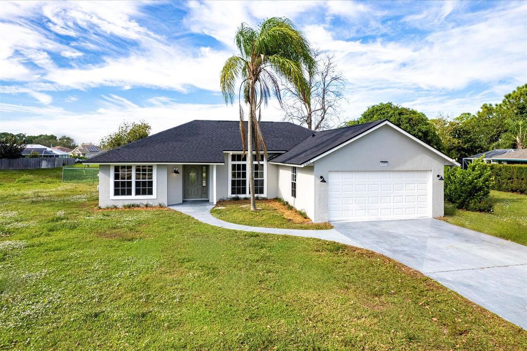 Photo of 4400 SW Idlewild Street, Port Saint Lucie, FL 34953 (MLS # R10938178)
