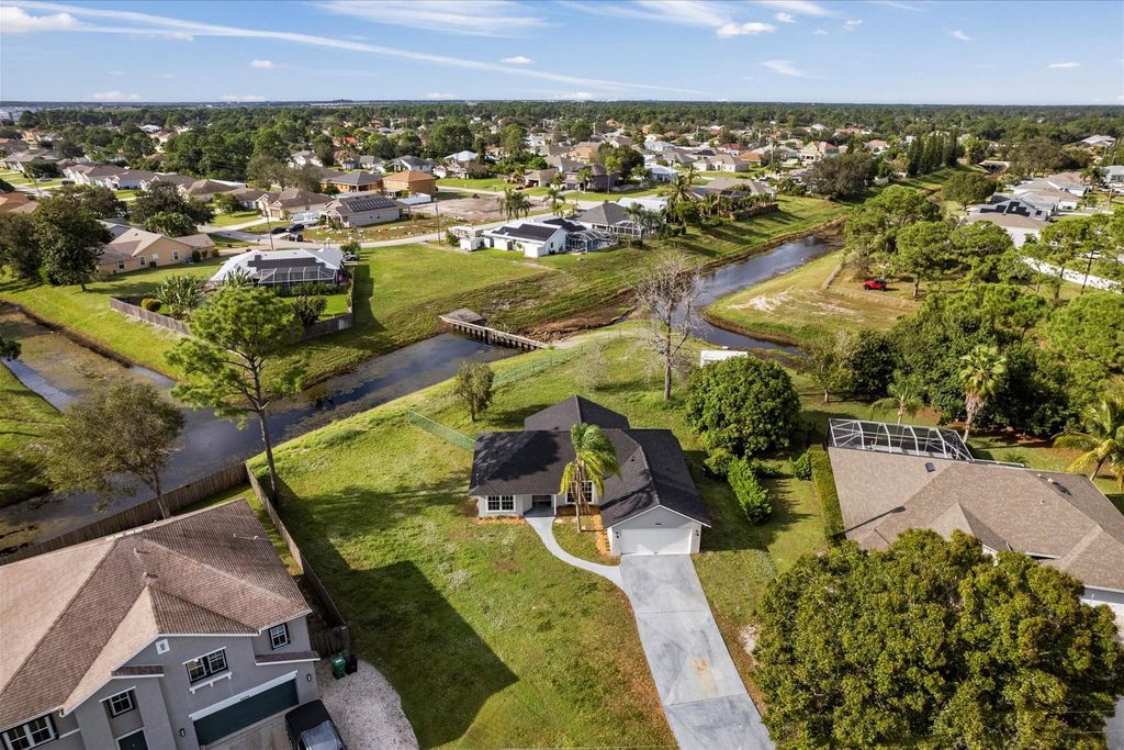 Photo of 4400 SW Idlewild Street, Port Saint Lucie, FL 34953 (MLS # R10938178)