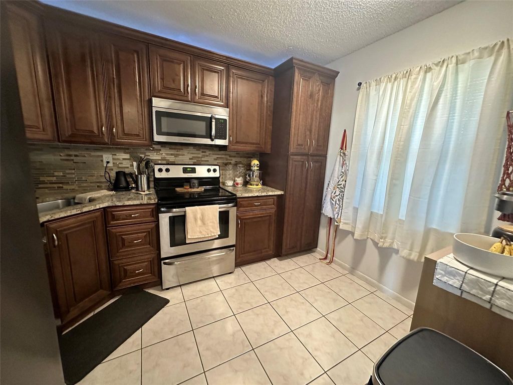 Photo of 2900 NW 42nd Avenue, Coconut Creek, FL 33066 (MLS # F10432882)