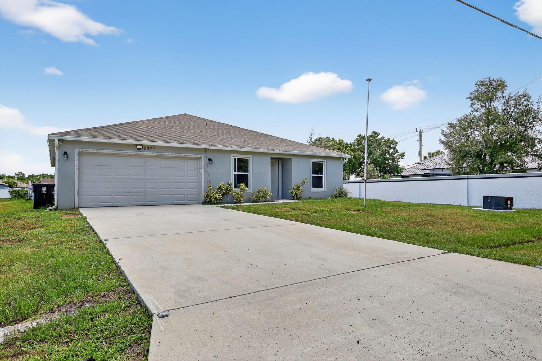 An incredible value for this 3 bedroom (possible 4), 2 bath home. It's only 4 years new!! This open floor plan offers stainless appliances in the kitchen, separate laundry and sliding glass doors that open up to a nice sized yard! Bedrooms are split allowing for privacy. A two car garage provides plenty of storage! Conveniently located near the Turnpike for easy commuting. Plenty of shopping and dining nearby and those legendary Florida beaches are only a short distance away!