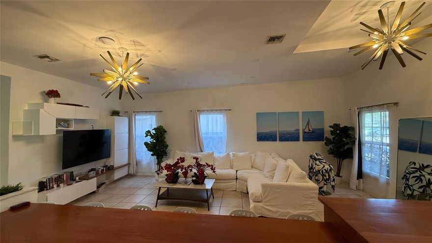 Wonderful Home on Large Lot. Home is designed to house up to 3 families. Can be used for rental income or Mother-in-law quarters. Very Large back yard with pergola and pool. Home has gone through some remodeling and comes furnished. This home has lots of natural light with the numerous hurricane impact glass windows and doors. Home shows some work needed, but for the most part already freshly remodeled and painted. Area is going through regentrification with numerous remodeled and or newly built homes. Very up and coming area.