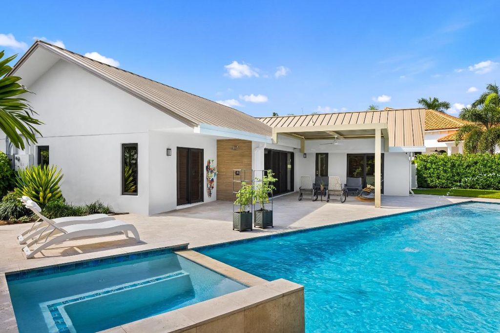 Photo of 843 NE Mulberry Drive, Boca Raton, FL 33487 (MLS # R11130777)