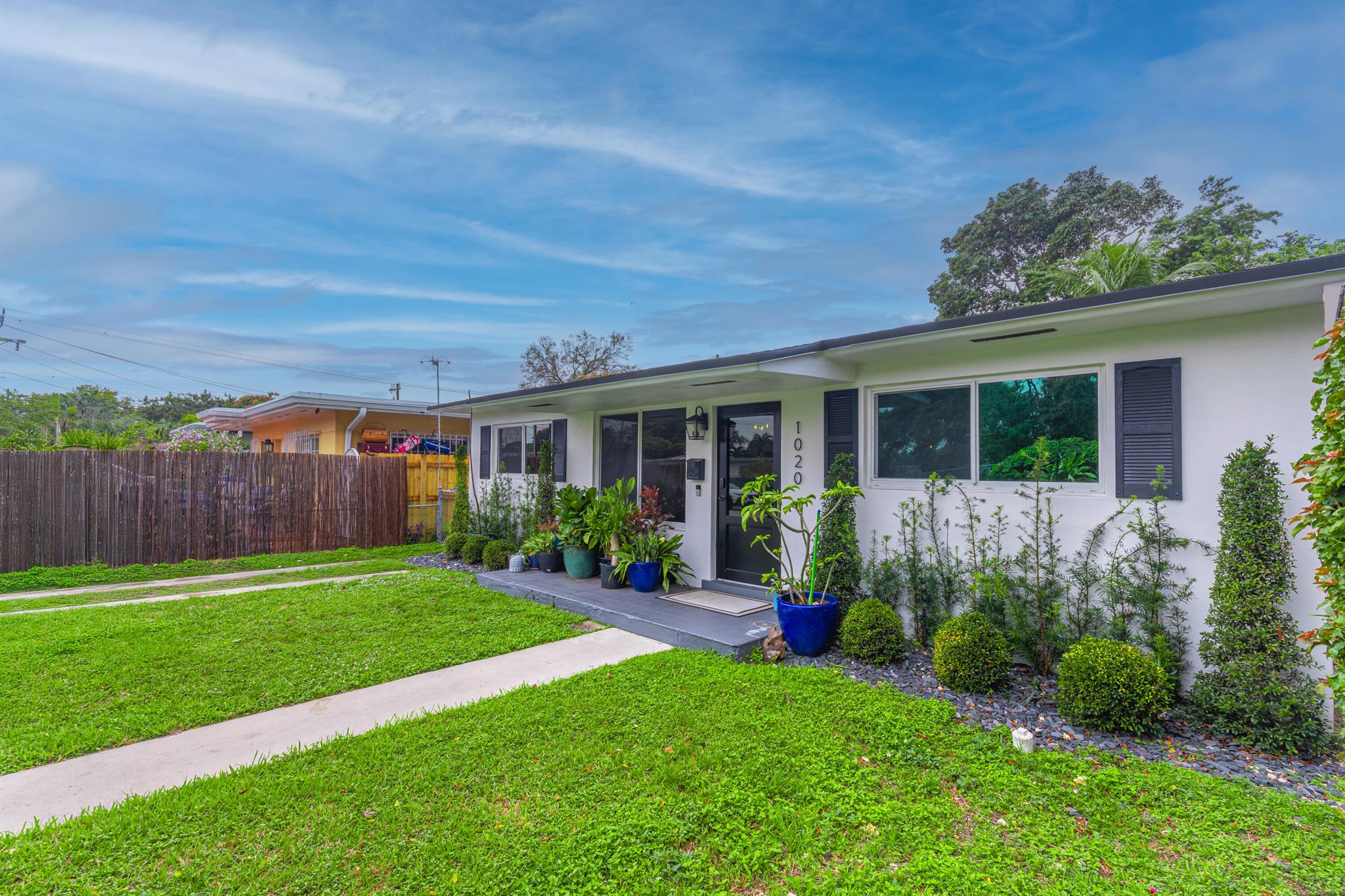 Recently refreshed and ideal for full‑time living or remote work, this charming single-story CBS‑constructed home features 1,743 sf of open living space and modern hurricane‑impact windows. Generous backyard with patio, ideal for al fresco gatherings. The functional layout includes a kitchen with full-size appliances (dishwasher, range, refrigerator, washer/dryer), a living/dining area that flows seamlessly to the backyard.