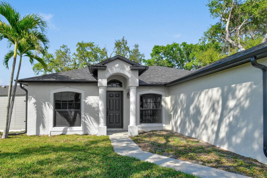 Photo of 1409 SW Gastador Avenue, Port Saint Lucie, FL 34953 (MLS # R11070012)