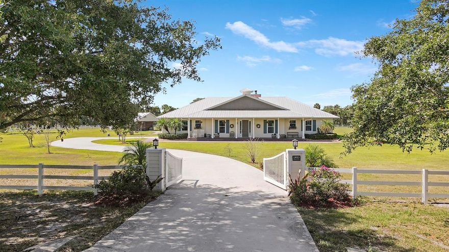 Stunning 4 bedroom 2 bathroom 2 car garage ranch home in the much desired equestrian neighborhood of Carlton Country Estates in Ft Pierce. Situated on over 5 acres and no shortage of upgrades including completely fenced lot with gated entry, pole barn that could easily be returned to a 3 stall horse barn with feed room and center aisle, private pond stocked with Tilapia and your own Par 3 green. Metal roof, complete impact windows and doors and peaceful front porch. Step inside to hand scraped laminate flooring, wood burning brick fireplace, dream kitchen offers granite countertops, farmhouse sink, soft close cabinetry, stainless steel appliances and walk-in pantry. Spacious masted bedroom with walk-in closet, custom shelving, claw foot soaking tub, dual sink vanity and walk-in shower. Screened back patio with tongue and groove ceilings, brick feature wall, newly installed paver deck, inviting in-ground salt water pool with sun shelf completed in only 2019 and private putting green.