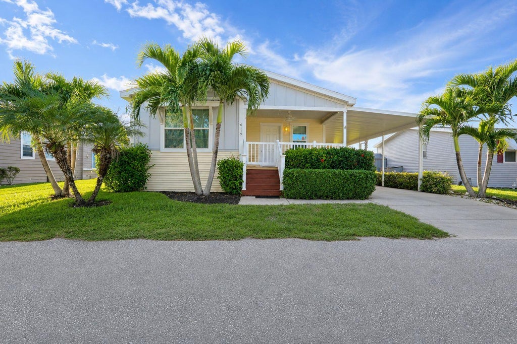 Photo of 6119 N Ficus Lane, Atlantis, FL 33462 (MLS # B26074175)