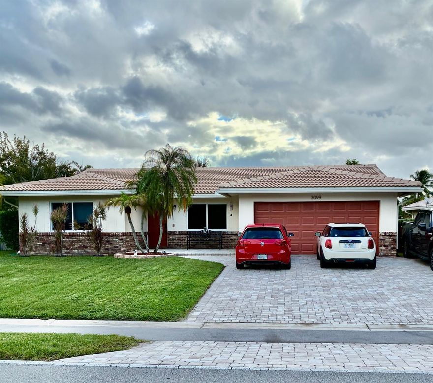 LOOK NO FURTHER!  THIS ONE IS NEAT & CLEAN WITH LOADS OF UPDATES & UPGRADES.  START WITH GREAT CURB APPEAL, AN OVERSIZED PAVER DRIVEWAY THAT CAN PARK 6 CARS, A 2023 S TILE ROOF, A QUARTER ACRE CORNER LOT WITH A BIG FENCED BACKYARD & A LOVELY FREEFORM POOL PLUS A COVERED PATIO.  INSIDE EVERYTHING HAS BEEN UPDATED INCLUDING THE FLOORING, KITCHEN AND BATHS. CEILINGS ARE ALL KNOCKDOWN (NO POPCORN) & FRESHLY PAINTED.   APPLIANCES & HOT WATER HEATER ARE LESS THAN 5 YEARS OLD. INSIDE UTILITY ROOM. HURRICANE PROTECTION ON ALL WINDOWS. NO HOA! GREAT LOCATION TOO OPPOSITE A PARK WITH WATERVIEWS & WALKING DISTANCE TO ALL THREE SCHOOLS.  THE PARK CONTAINS A FITNESS CENTER, DOG PARK, AQUATIC CENTER, TENNIS CENTER, NATURE CENTER & SKATING RINK. NOTE: LIGHT ABOVE POOL TABLE TO BE REPLACED.