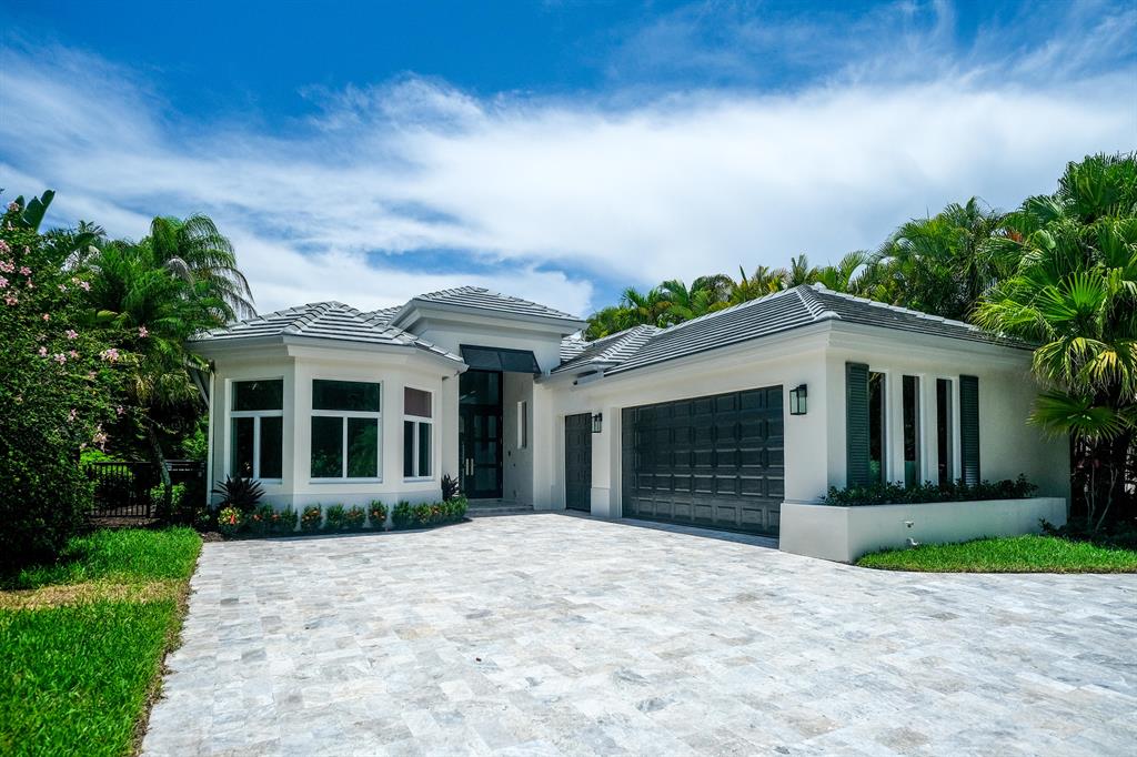 Beautiful redesign by Dreamstar Custom Homes. This home features an open floor plan with 3 bedrooms, 3 full baths, 1 half bath and a den. All new impact windows and doors, roof, stucco, HVAC, electrical and plumbing are just some of the upgrades in this luxury remodel. With a beautiful private water view, the expansive covered patio with summer kitchen is a great place to relax. Located just minutes from the clubhouse at award winning Frenchman's creek beach and country club. This home is renovation perfection with no detail overlooked.