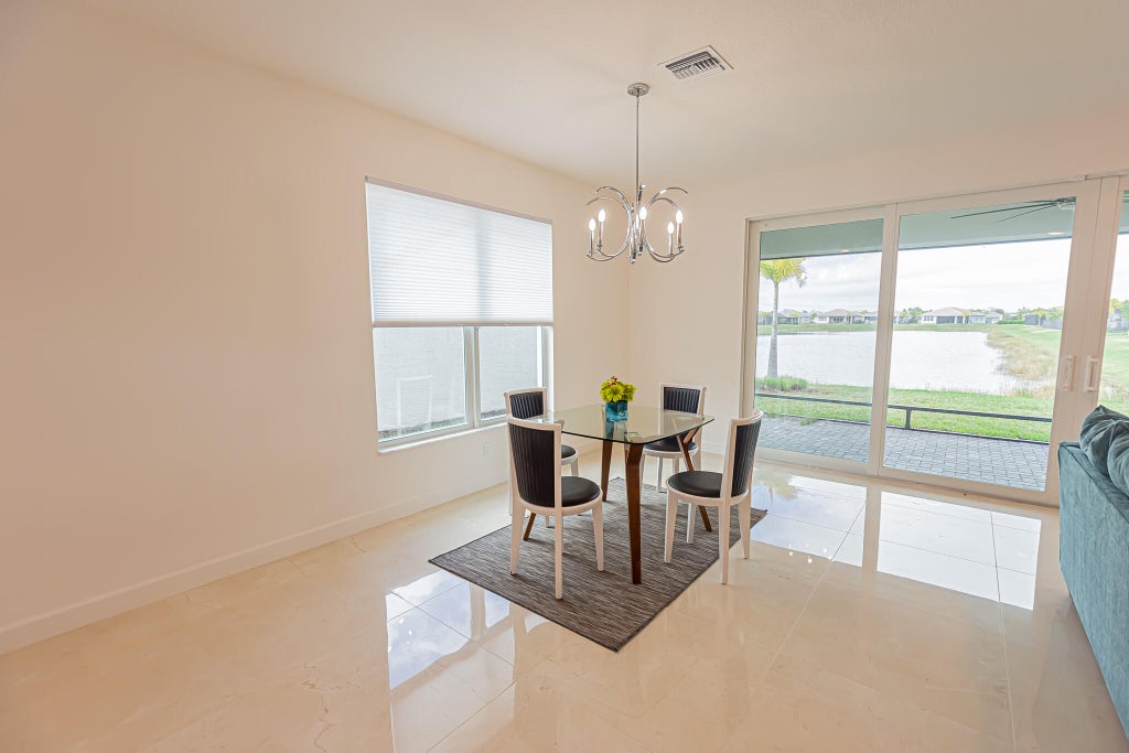 Photo of 11750 SW Poseidon Way, Port Saint Lucie, FL 34987 (MLS # R11067659)