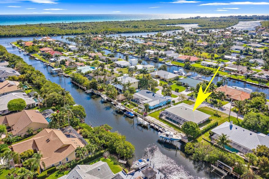 Located just minutes to beaches, parks, golf courses, restaurants, and boutique style shopping by car, and nearly 7 miles to the ocean by boat with waterfront restaurants to pull in to along the way.  Rinse off in the pool and relax in the spa after a full day of fishing. Double lifts in the backyard currently holding a 35 foot and a 28 foot boat. Impact glass and concrete construction makes this even more desirable.