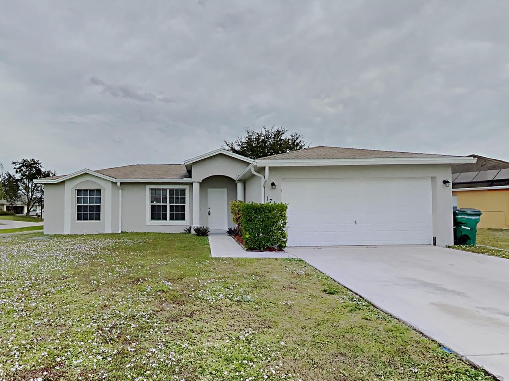 Photo of 1711 SW Gloria Lane, Port Saint Lucie, FL 34953 (MLS # B26042763)