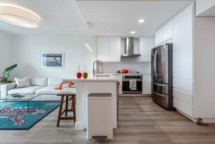 2 Deeded Garage spaces for this completely renovated, high floor, furnished condo. Vinyl plank flooring thruout. Completely open Euro-style kitchen with Quartzite countertops and stainless steel appliances - separate cooktop and oven. Main bedroom is on suite with stunning marble tile bathroom and open walk-in shower. 2nd bathroom - has a tub shower. All windows have remote operated blinds with blackouts in the bedrooms. Newer front-load washer & dryer in unit. Fitted closets. Mostly Furnished with high end furniture. Large balcony with city views. Visitor parking available. Less than 1 block from Underline path. Building has just undergone renovation work in lobbys and hallways with exceptional new mobile accessible access system. Great city-view pool deck and gym available for resident