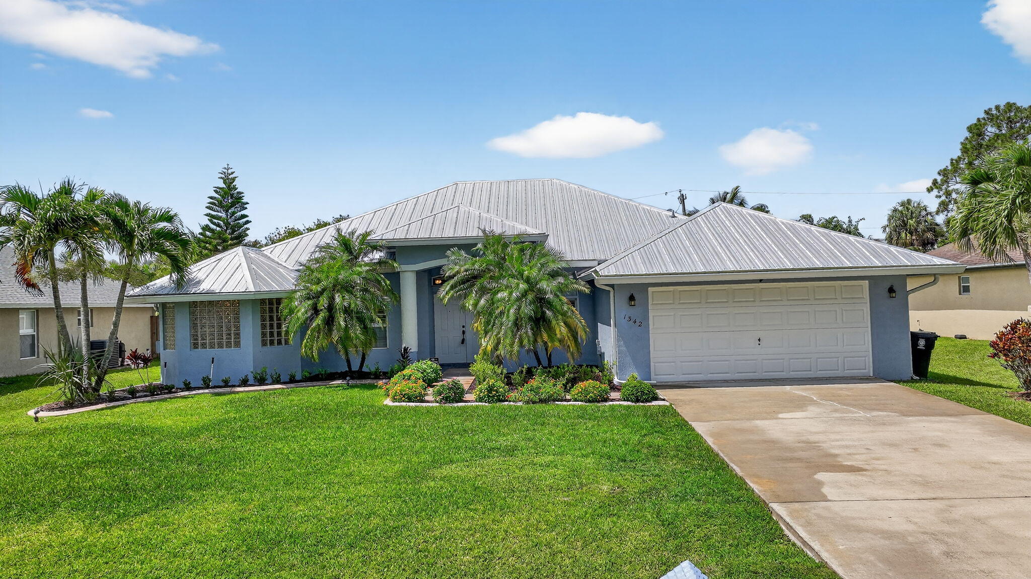 Immaculate Pool Home: 3 BR + Den/Office, 2 BA, 2 car garage & big ticket upgrades: 2022 new metal roof & new HVAC, 2021 water heater, new flooring & large updated kitchen. Double front doors lead to sun filled formal living & dining rooms, all laid with LVP floors through every room. The spacious primary suite opens directly onto the covered pool lanai, while its spa like bath with walk in shower & soaking tub. The heart of the home, the open kitchen showcases granite counters, custom backsplash, SS appliances, plenty of prep space & cabinets & is open to the family room & breakfast nook. For entertaining Family & Friends, this flows to the screened pool & fenced, tropical backyard creating entertainer's paradise with room to grill, play and unwind. Come enjoy the Florida lifestyle today!