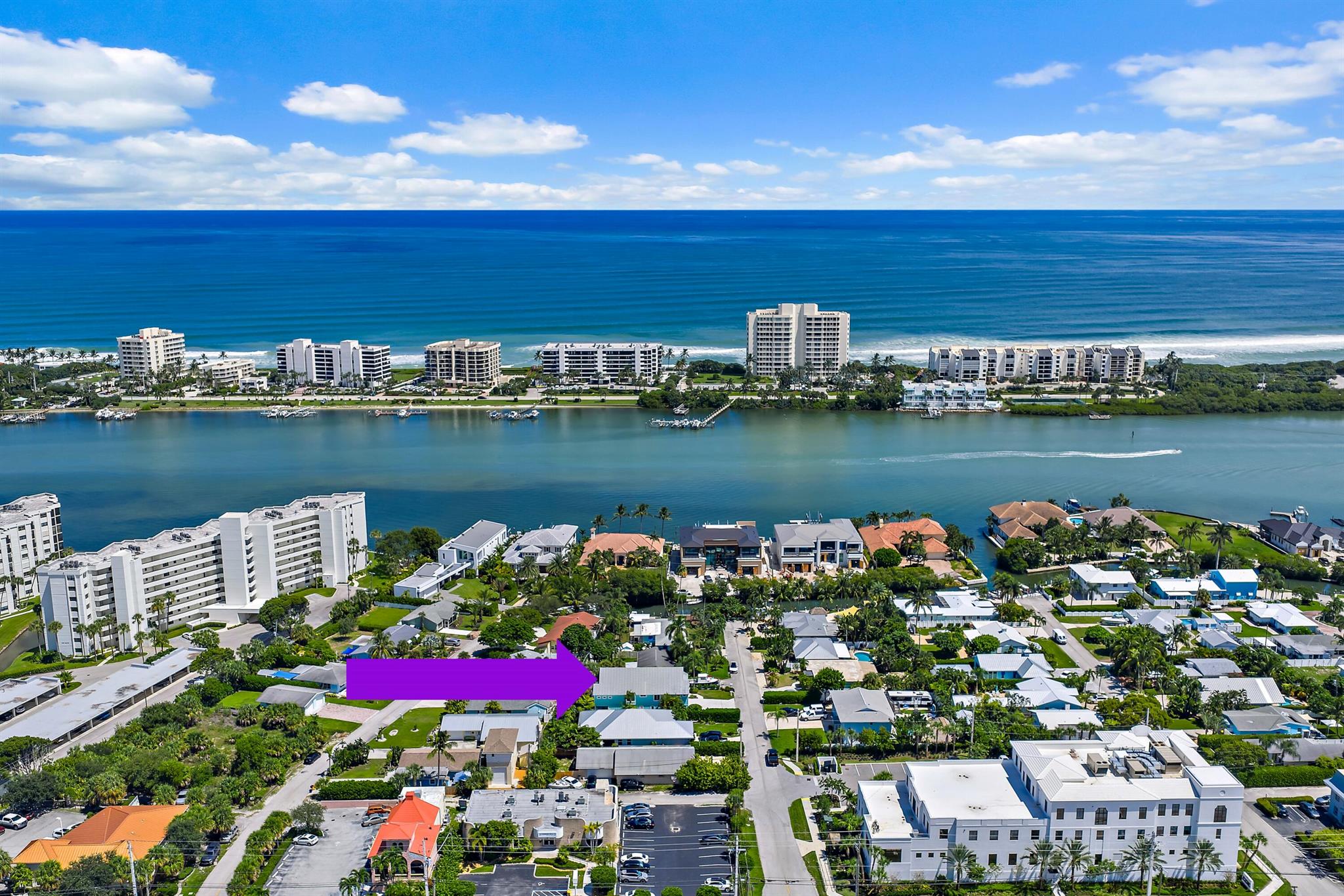 Imagine mornings spent snorkeling at Cato's Bridge, afternoons fishing or cruising the Intracoastal, and evenings unwinding with family and friends on your spacious balcony, in the backyard spa, or around a fire pit under the stars. This home in highly sought-after Jupiter Heights puts it all within reach. Offering just under 3,200 sq. ft., the layout is ideal for family living and entertaining. The first floor features its own living area and bedroom--perfect for guests or multi-generational use--while the second floor includes three additional bedrooms, two full baths, plus an open kitchen, dining, and living space designed for gatherings. Outdoors, a large balcony invites you to enjoy coastal breezes, while the backyard offers a relaxing spa and a soon-to-be-completed fire pit for cozy