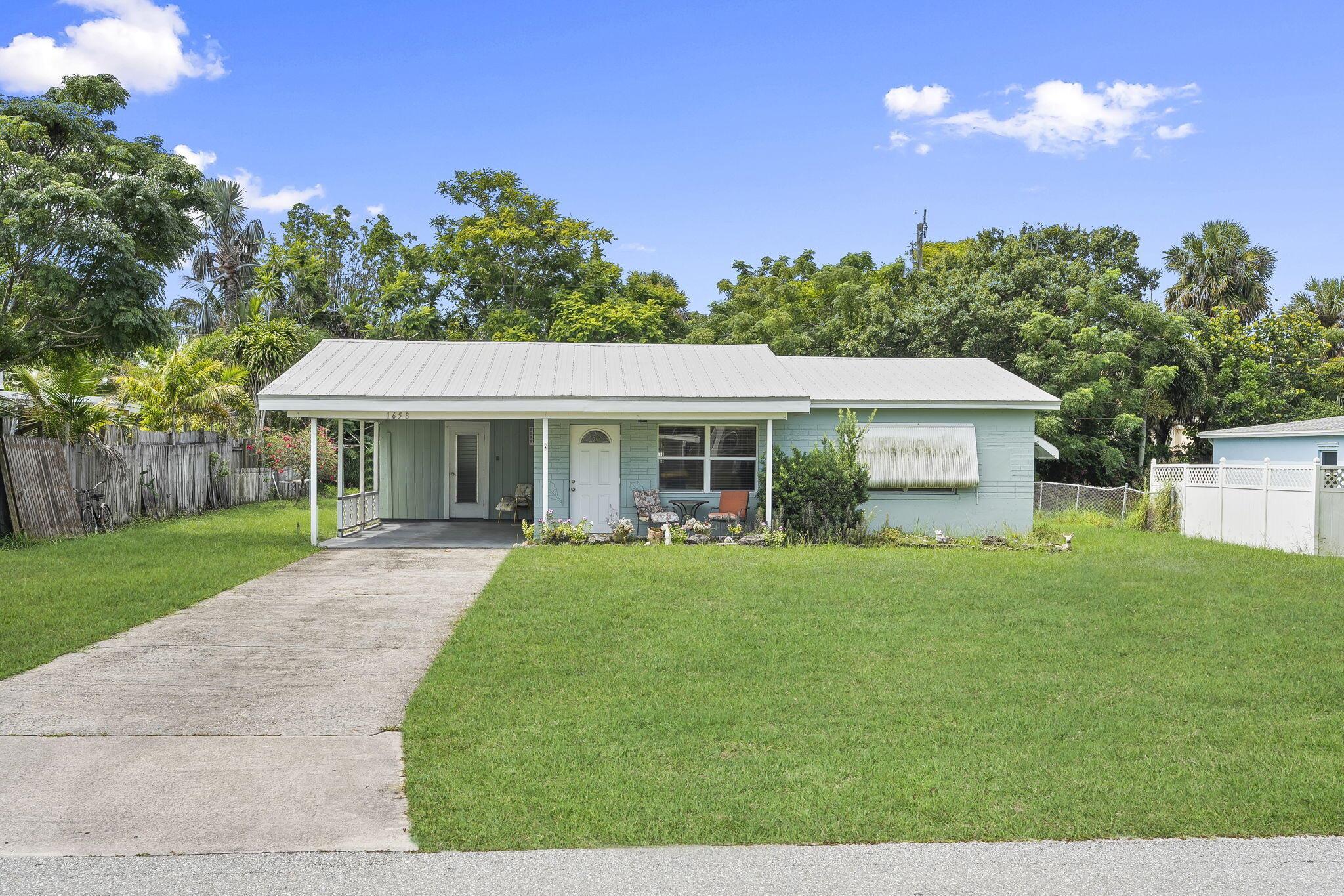 Desirable Jensen Beach Location! Freshly Painted interior. Concrete Block One Story 2 Bedroom, 2 bathroms with carport. NO HOA! Truck/Trailer Friendly & Pet Welcome! (case by case). Florida Room can easily be a dining room or a 3rd bedroom. Jensen Beach Elementary School District! Full size Washer in an adjacent utility room plus a 240 SQ FT Covered Carport. Lawn Maintenance is included in Your Lease. The House has City Water. Quick jaunt to the Intracoastal Waterway, Historic Downtown Stuart, Jensen plus Hutchinson Island Beaches.