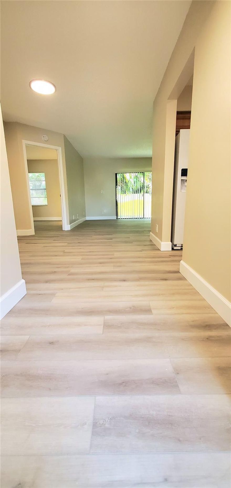4 bedroom renovated apartment! Excellent Coral Springs location across from The Walk and Library. Freshly painted and updated with new LVP flooring throughout. Spacious living room, dining area large enough for a six-person table, full size washer and dryer set, and direct access to a back yard. First floor unit.