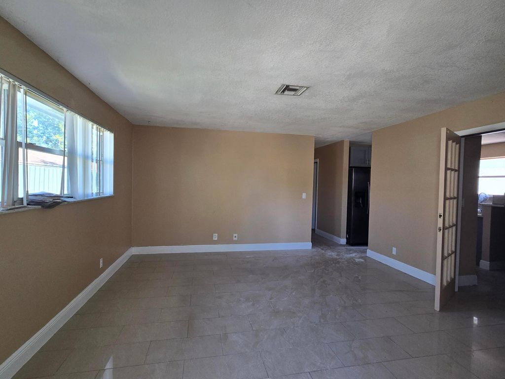 Photo of 815 Silver Beach Road, Lake Park, FL 33403 (MLS # B26026872)