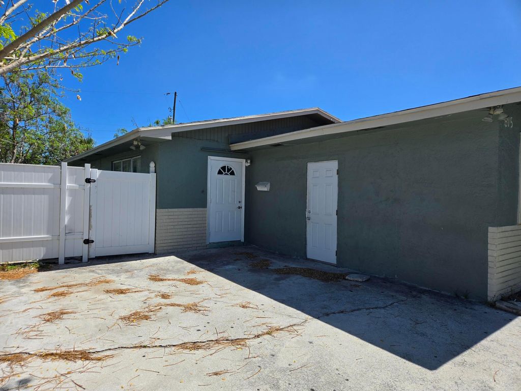 Photo of 815 Silver Beach Road, Lake Park, FL 33403 (MLS # B26026872)