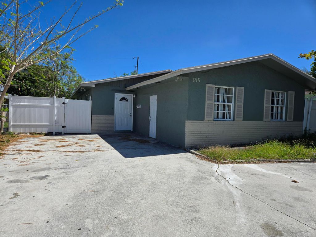 Photo of 815 Silver Beach Road, Lake Park, FL 33403 (MLS # B26026872)