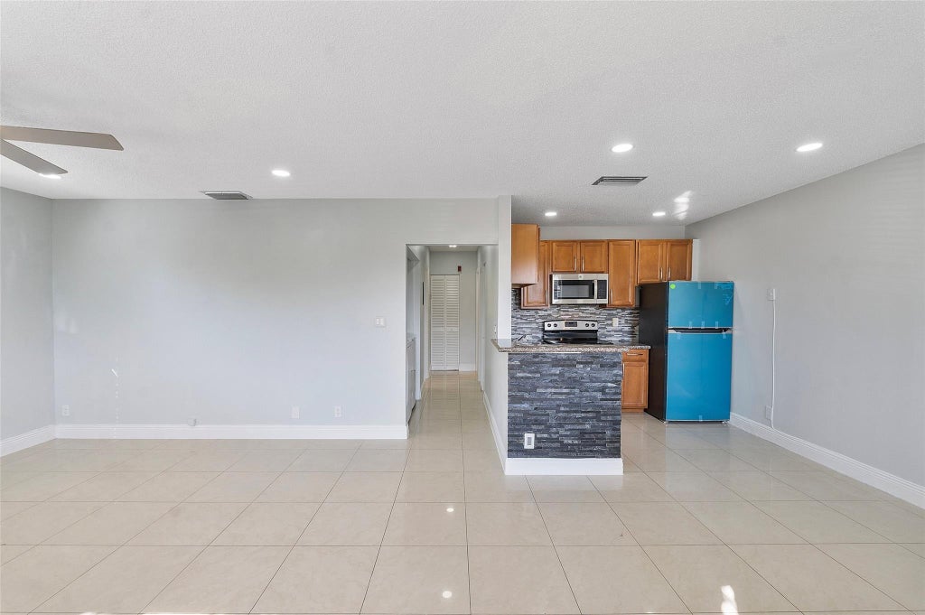 Photo of 2854 Coral Springs Drive #2854, Coral Springs, FL 33065 (MLS # B26036688)