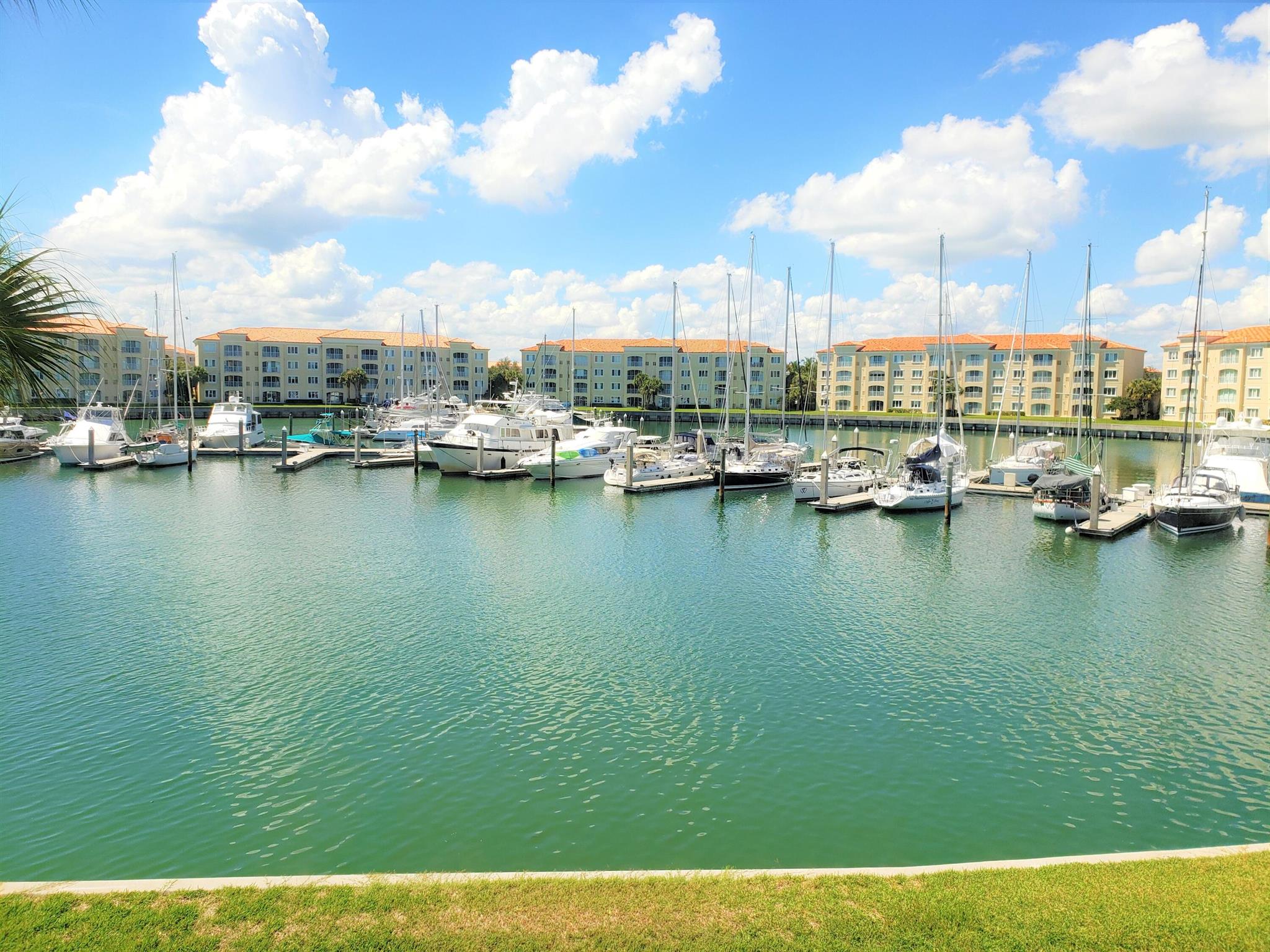 Truly stunning, like new, 2nd Floor, 1989 sq ftc condo overlooking the Harbour Isle Marina! King size master suite has wi-fi charging station at bedside, 800 thread count linens, pillows and towels. A large mounted 55'' TV with a recliner chair to relax and read your favorite book. Stunning sunset views. Spacious his/hers closets and a large Master Bathroom with double vanities, a soaking tub and stand up shower. Guest bedroom has a queen size mattress, bedsize charging station, all 800 thread count linens and pillow and a wall mounted 43 '' TV for relaxing after a day at the pool. The proximity of the guest room makes this space a mini master suite. The living room and dining room complete the perfect entertaining experience. The marina views are magnificent. Come view this lovly coondo.
