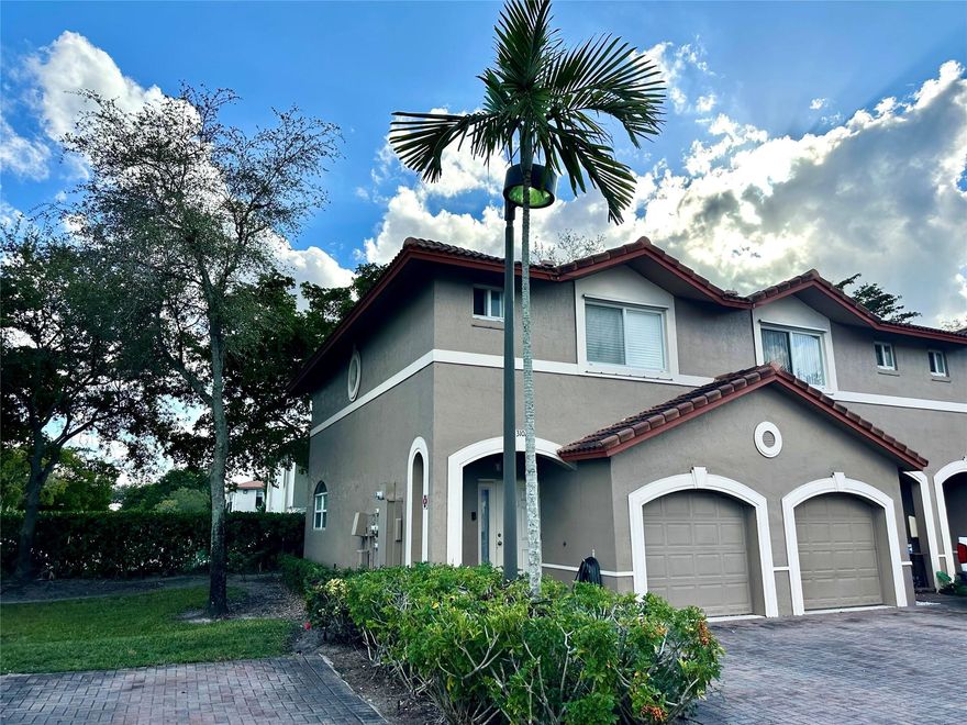 Wonderful 3 bedroom, 2 1/2 bath, **corner** 2-story townhouse/condo in Coral Park Townhomes West with attached 1-car garage and private 2-car driveway!! New A/C and hot water heater, neutral tile, new wide-plank wood-look flooring on staircase and entire upper level, freshly painted throughout, open kitchen, full-sized washer/dryer, rear open patio, hurricane shutter panels for all openings, and conveniently located in the heart of Coral Springs! Investors welcome, rent out immediately after closing! Great opportunity to own this great home with attached garage and your own private driveway!