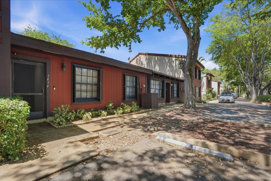 Welcome to Tamerlane—an exceptional, park-like enclave beneath mature oak canopies and ideally located across from T.Y. Park. This beautifully updated 2BR/2BA villa offers a extra room , ideal as a private office, guest room, or another bedroom  delivering elevated South Florida living in a highly desirable South Broward location.  Soaring vaulted ceilings create an airy, light-filled interior, complemented by a renovated kitchen featuring modern cabinetry, quality countertops, and upgraded appliances including in-unit washer and dryer. Thoughtful updates throughout enhance both style and everyday functionality.  Enjoy a pet-friendly, well-maintained community with resort-style amenities and a low HOA, offering effortless living in a serene setting.