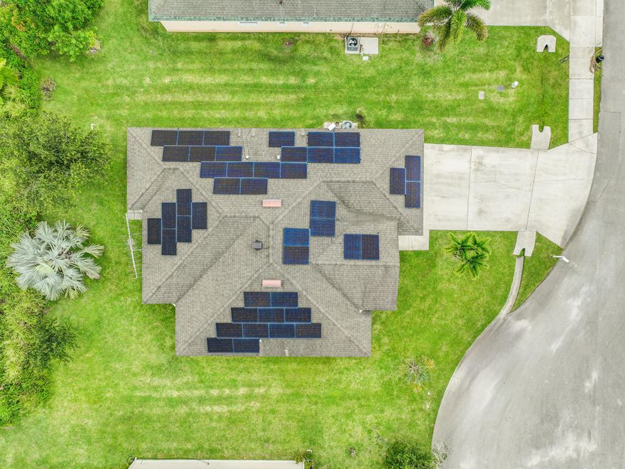 2017-BUILT. FREE POWER!! NE PSL. SAVE $Thousands/Year With NO Power Company (FPL) Usage!! 2017-Built CBS Nearly 1900sf 3+Den/2/2 w/ 2022 EXTENSIVE 17.6KW WHOLE HOUSE SOLAR SYSTEM ($72K System! Remaining Balance Will Be Paid Off By Seller!) Located on Quiet Cul-De-Sac. Granite Kitchen w/ Hi-End Maple Cabinets. Large Family Rm. Den/Office Could Be 4th Bdrm. NO NEIGHBORS BEHIND. Elementary 5 Minutes away! Intracoastal 10 Minutes. Roman Tub/Separate Shower And Dual Vanities In Mstr Bath. Covered Patio. Remarkable Value. (Agent Can Provide Utility Bill Showing NO FPL USAGE For Buyer Review.)