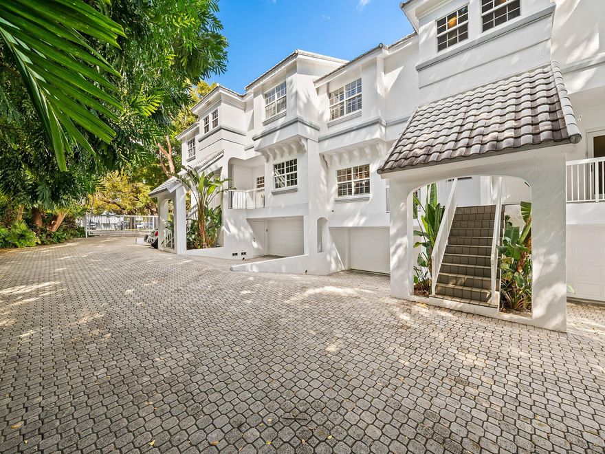 Boutique style 11-unit Villas Las Olas gated townhouse community, with PRIVATE DOCK sits directly between Fort Lauderdale Beach and the vibrant Las Olas scene in Colee Hammock. A 3BR/2.5BA, 1930 SF contemporary open-concept living space includes a wood-burning fireplace, dramatic high ceilings, and grand sliders that lead out to a tranquil tropical patio. The generous kitchen open to the dining area and living room, is well equipped with ample storage and large walk-in pantry. Above is a beautiful primary suite with a serene spa-like bath, a separate soaking tub and rain shower, two comfortable additional bedrooms, and a full guest bathroom. Large 2 car garage with additional storage, pet-friendly and only 1.3 miles to the beach. Boat slip can accommodate up to a 25' boat.